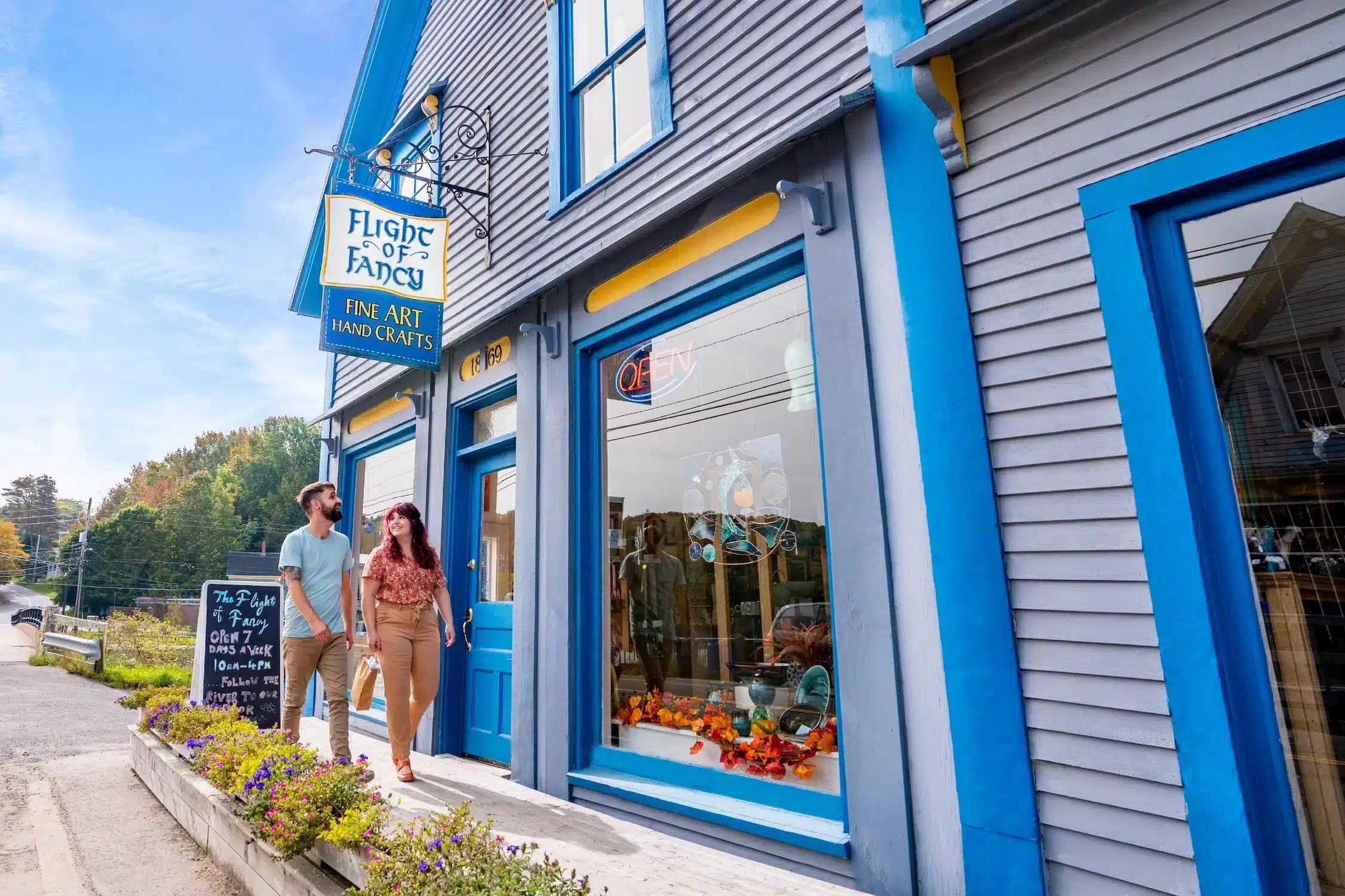 couple walking outside a store in Bear River